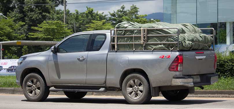 pickup carrying load covered with tarp